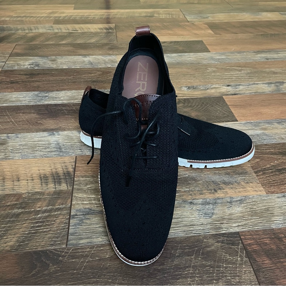 Black and brown Cole Haan All Cabin low top lace up shoes